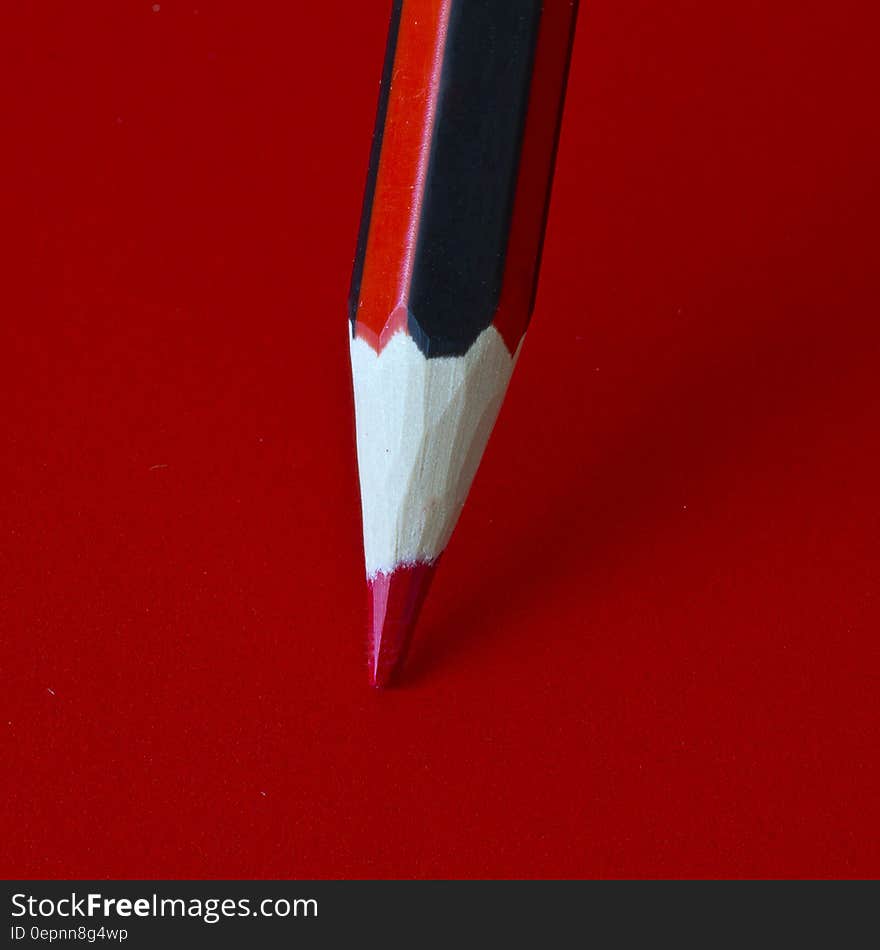 Red Pencil on a Red Surface