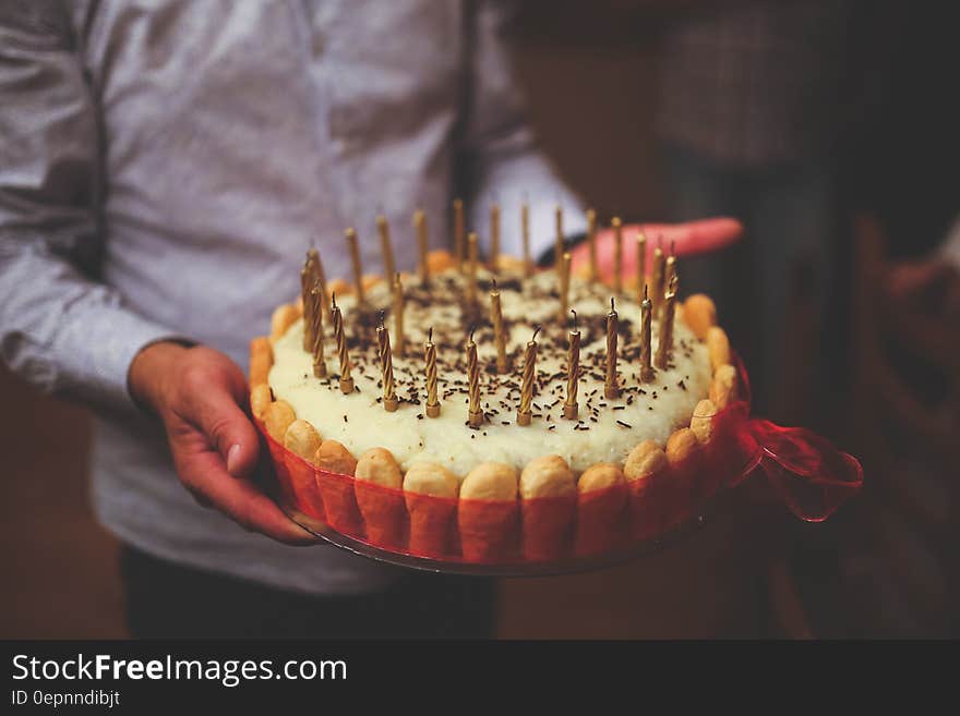 Birthday cake in men&#x27;s hands