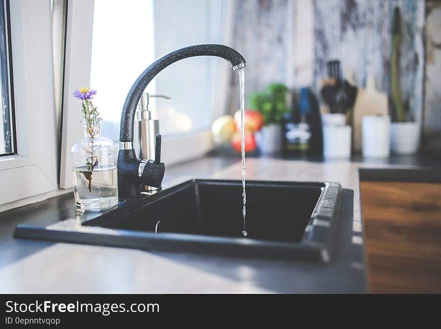 Water flows from the tap to sink