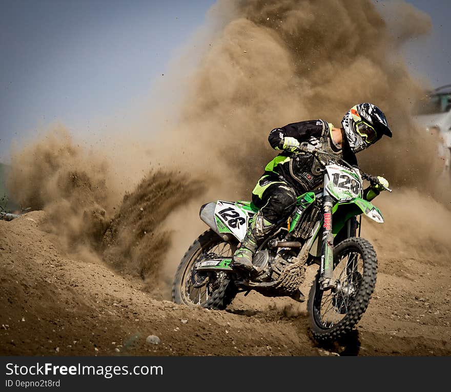 Rider Riding Green Motocross Dirt Bike