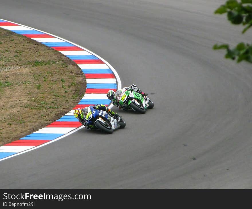 Racing Between 2 Men Riding Motorcycle