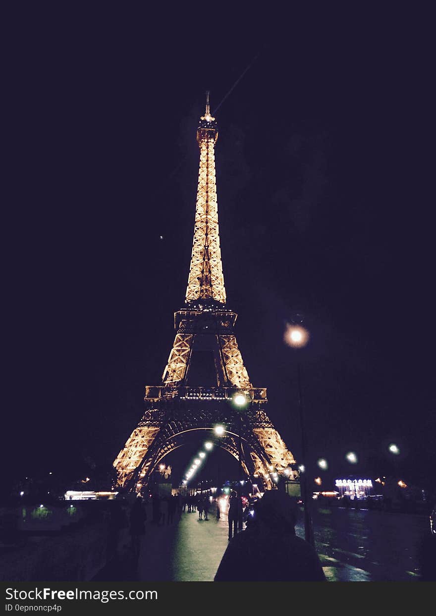 Eiffel Tower in Paris, France illuminated at night. Eiffel Tower in Paris, France illuminated at night.