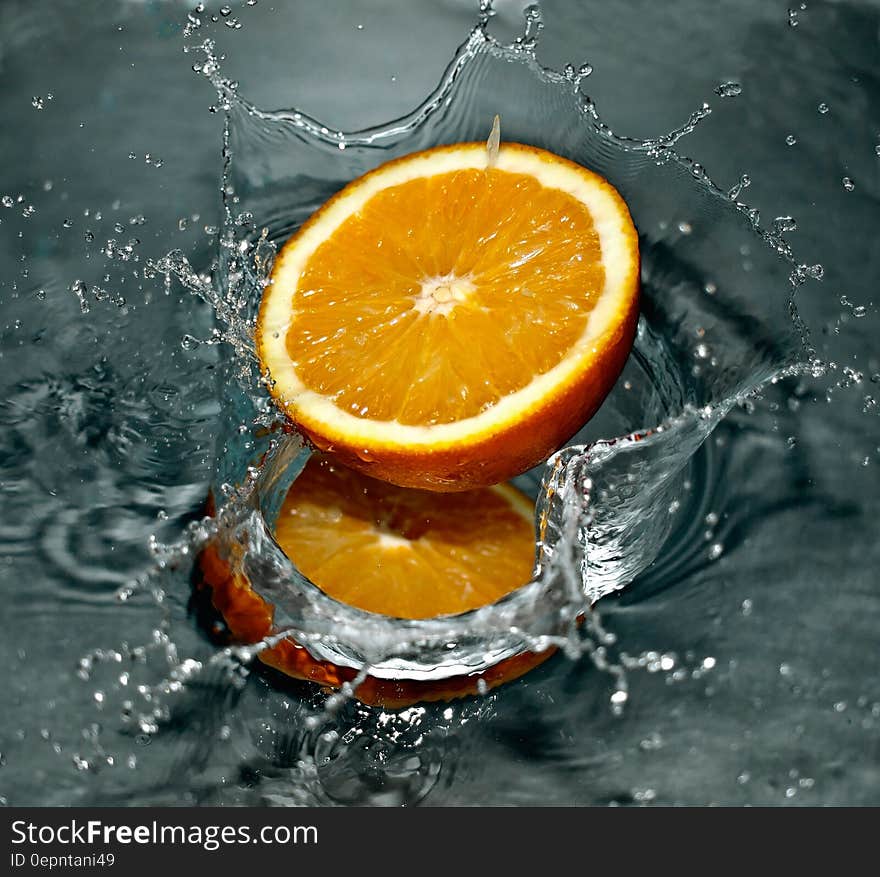 Time Lapse Photography of Orange Fruit on Water