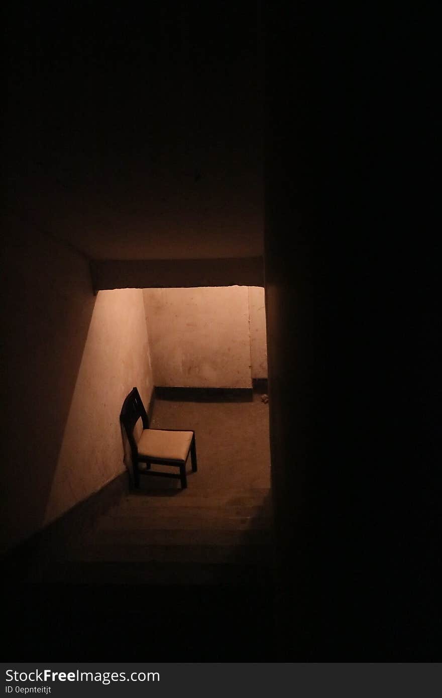 Black and White Wooden Chair Near Stair