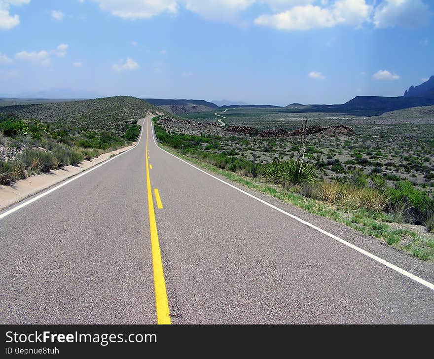 Gray Concrete Road With White Safety Line during Daytime