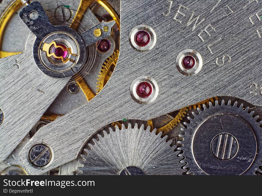 A close up of the mechanism of a mechanical watch. A close up of the mechanism of a mechanical watch.