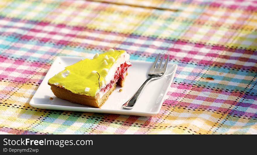 Yellow and Brown Pastry on White Saucer