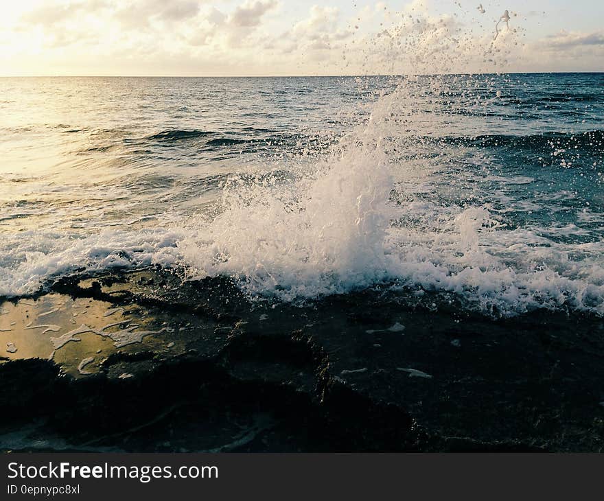 Scenic view of waves breaking on beach.