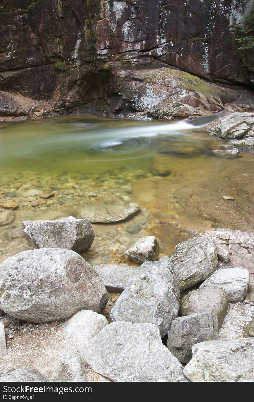 A view of a river with rocks.