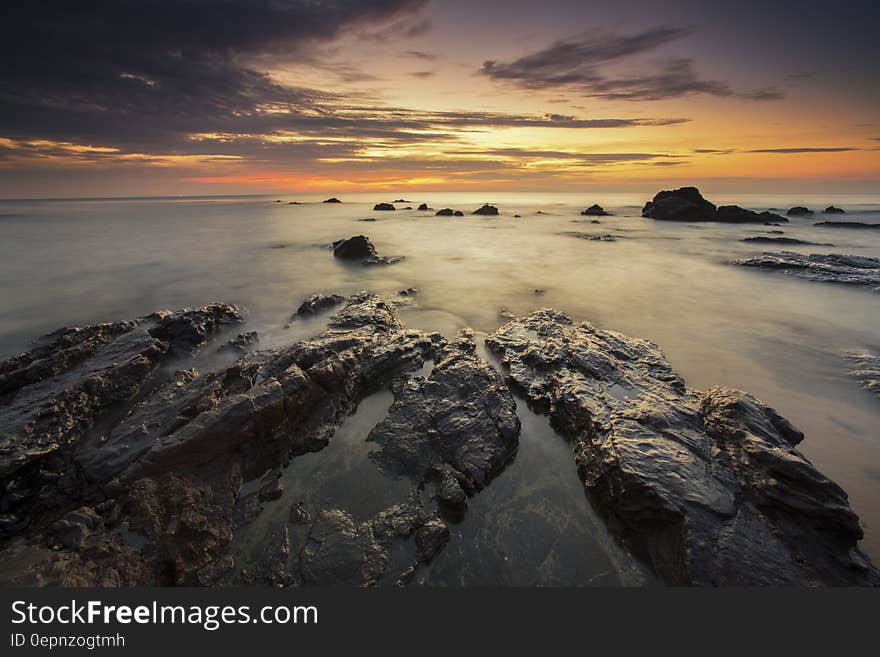 Brown Rock Formation Under Sunset