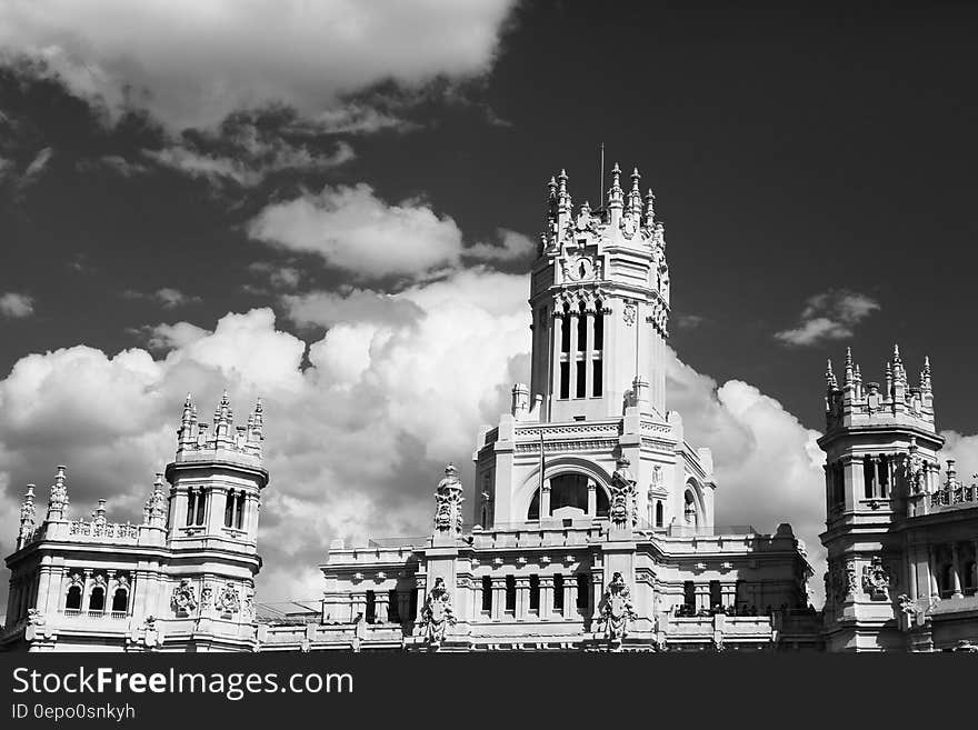 Facade of palace against cloudy skies in black and white. Facade of palace against cloudy skies in black and white.