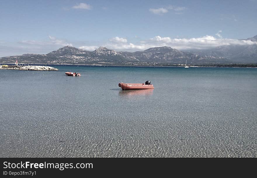 Inflatable raft boats on waters of alpine like on sunny day.