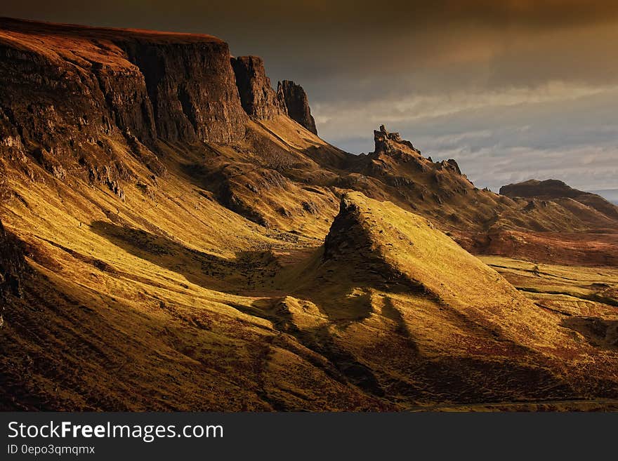 Brown Cliffs Under Gray Sky