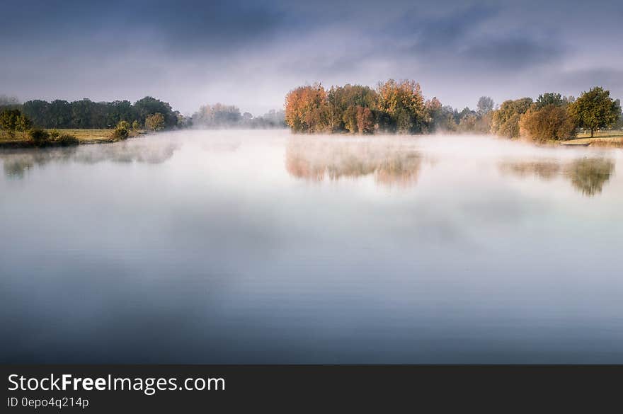 Lake With Fog Under Dark Blue Sky Photography