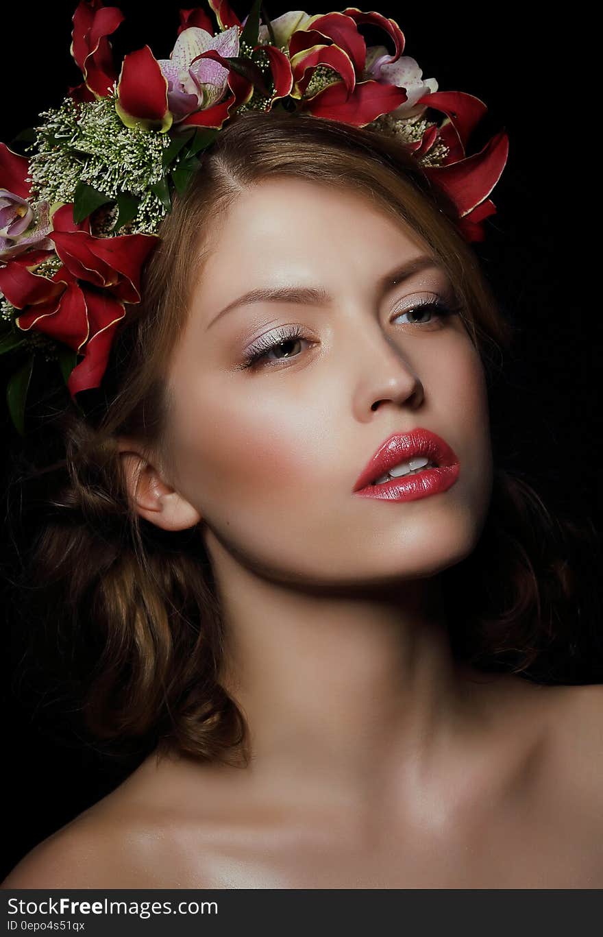 Woman Wearing Red Floral Headdress