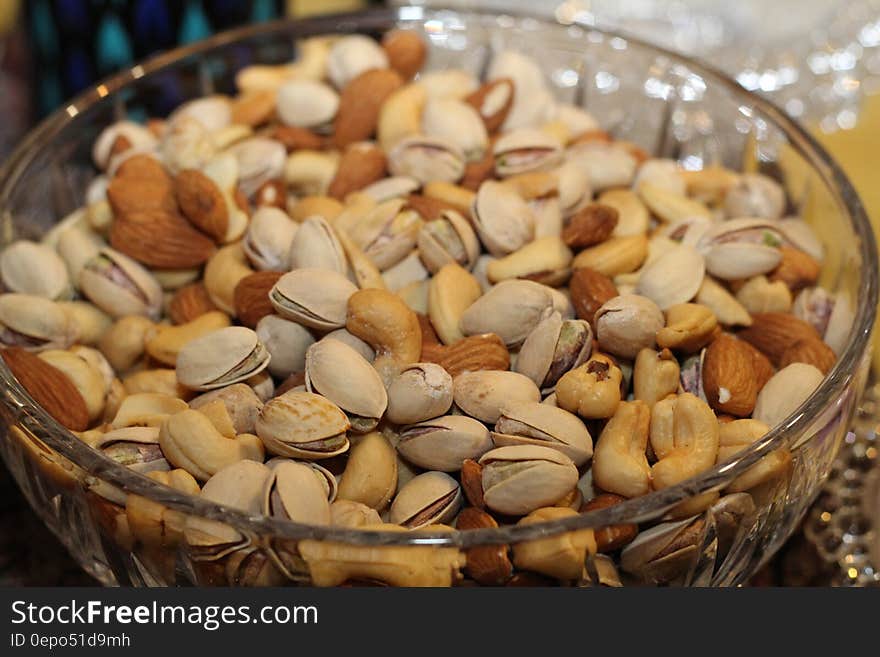 White Yellow and Brown Peanut on Clear Glass Basin