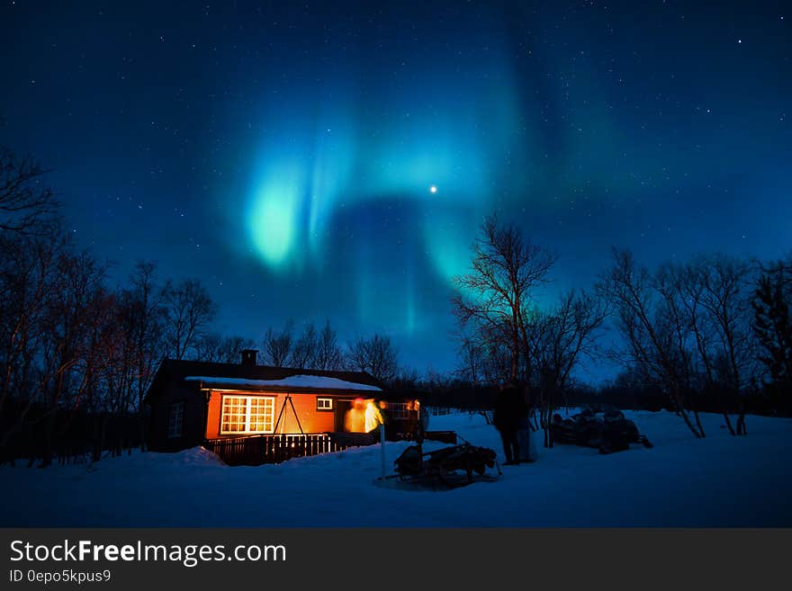 Brown Cottage Under Aurora