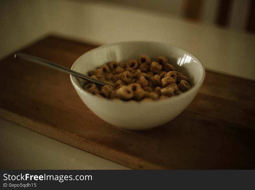 Cereal on White Ceramic Bowl With Spoon