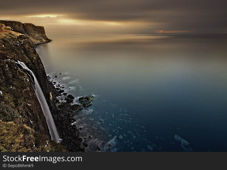 White Fabric Hanging on a Cliff