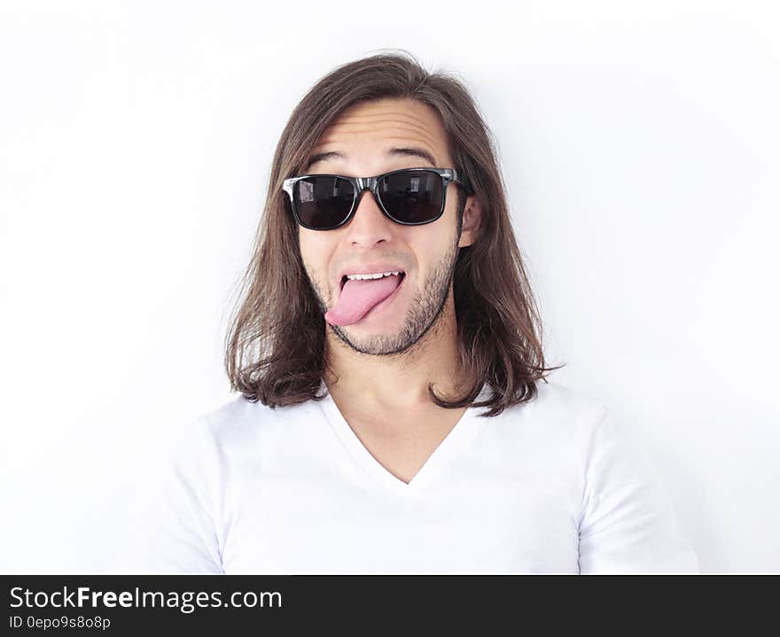 Man Wearing Sunglasses and White V Neck Shirt