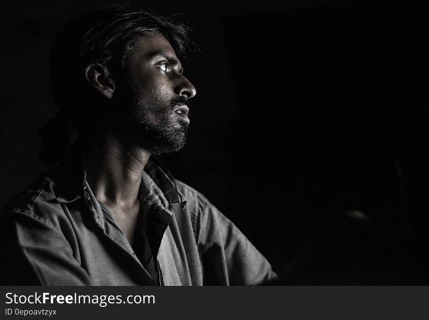 Man in Gray Polo Shirt during Night Time