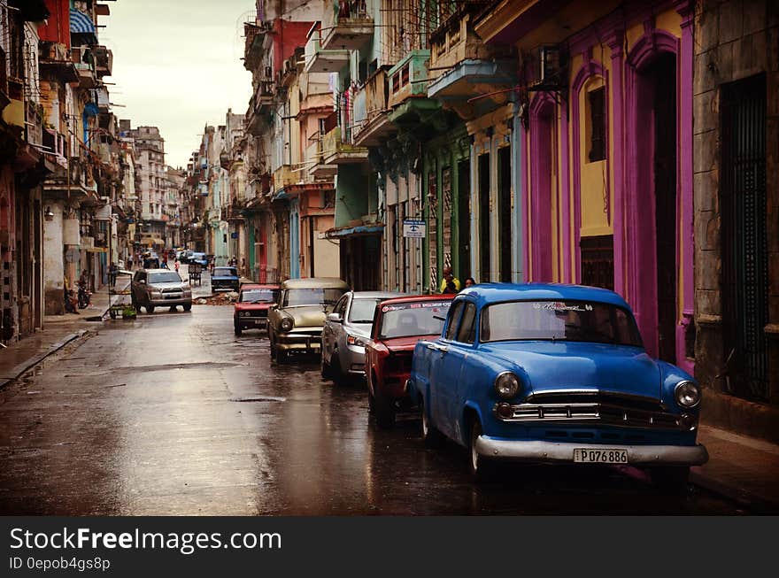 Cars Parked Near Buildings during Daytime