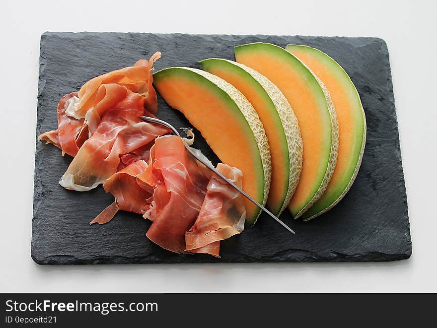 Melon on Black Tray