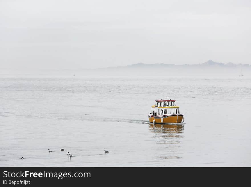 A small boat on foggy sea. A small boat on foggy sea.