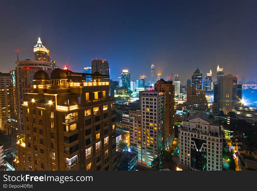 Urban skyline illuminated at night. Urban skyline illuminated at night.