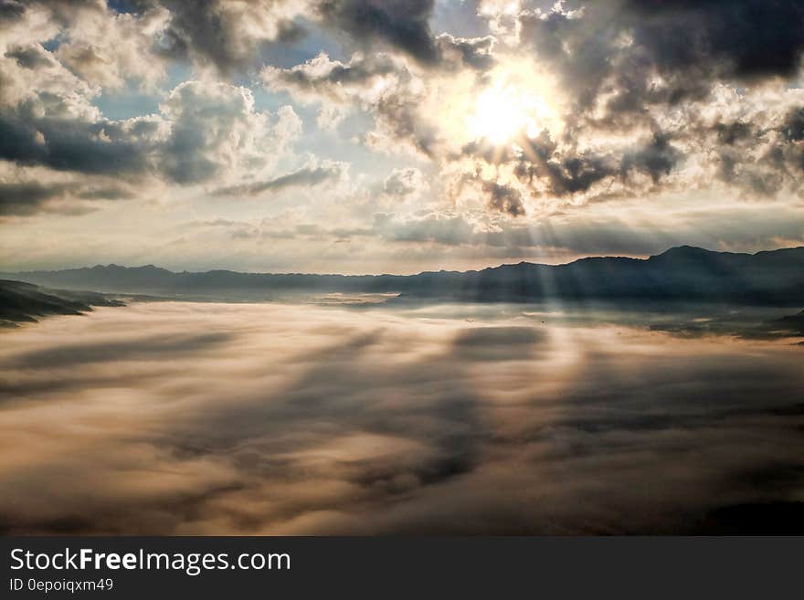 White Clouds With Sun Piercing Through It