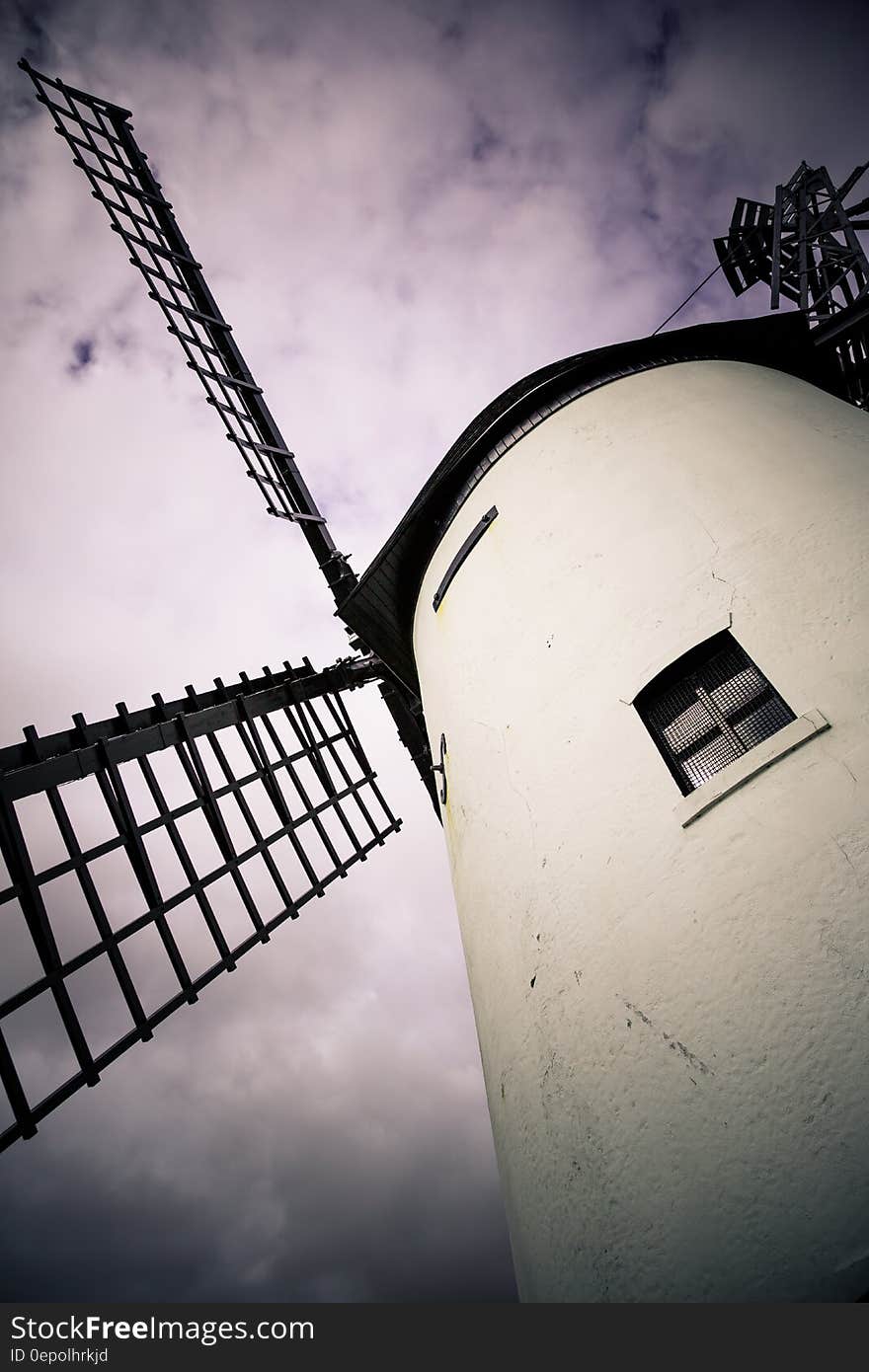 Exterior of vintage windmill against cloudy purple skies, The Netherlands. Exterior of vintage windmill against cloudy purple skies, The Netherlands.