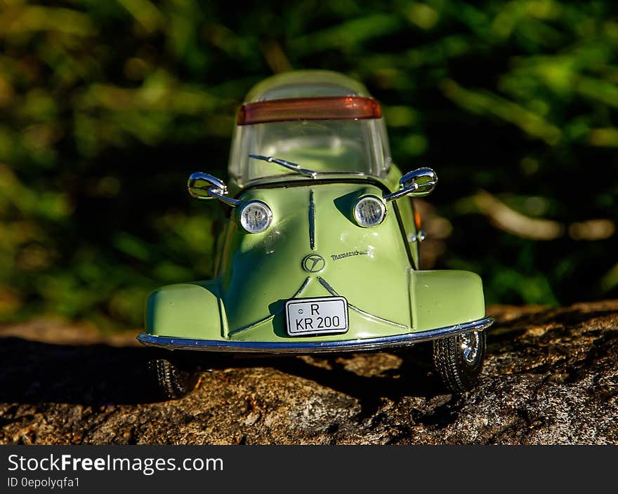 Green and Gray Miniature Car Toy