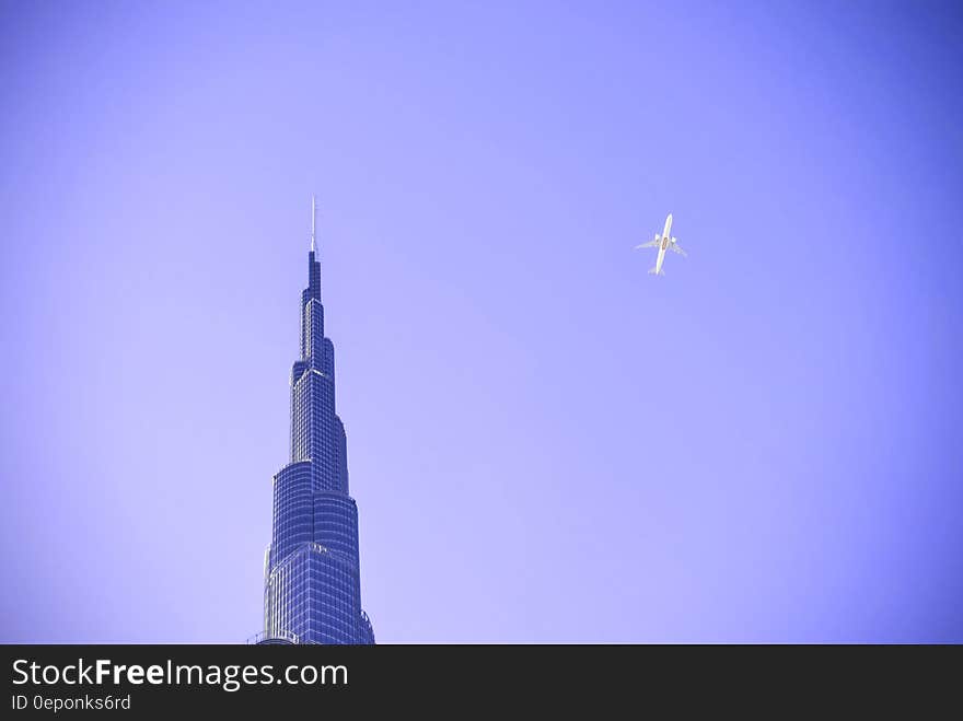 A plane on the sky over the Burj Khalifa in Dubai.