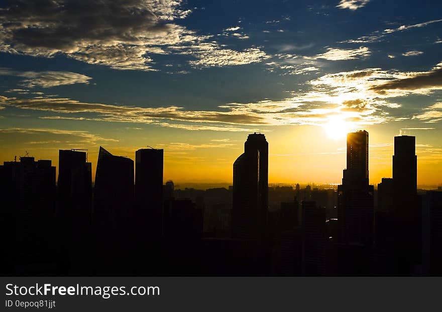 Silhouette Photo of City Building during Sunset