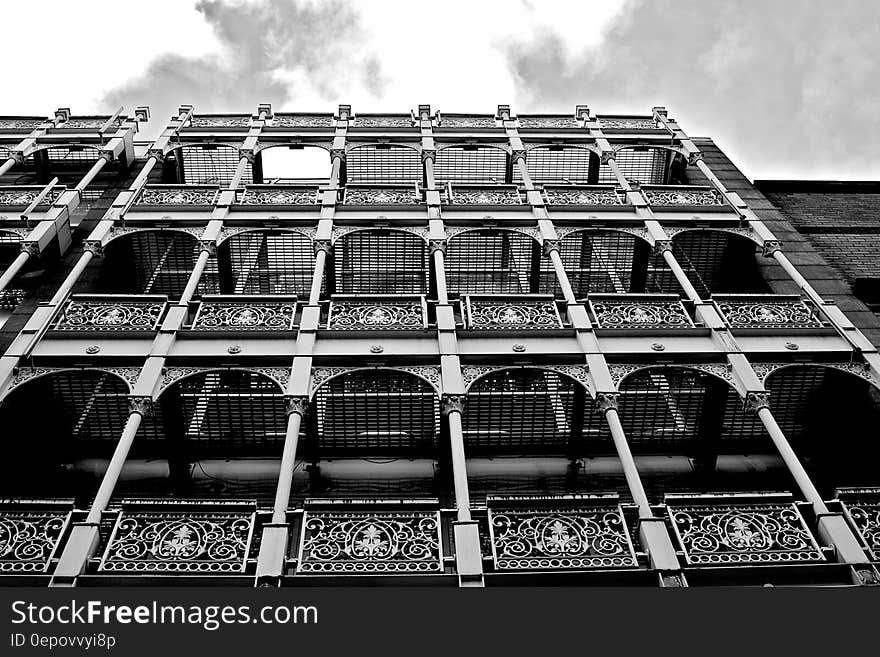 Apartments with balconies creating an interesting background pattern for architectural subjects, sky and cloud above. Apartments with balconies creating an interesting background pattern for architectural subjects, sky and cloud above.