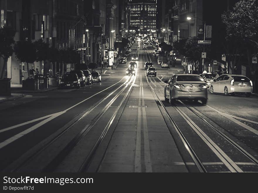 Trolley tracks down streets of San Francisco, California at night.