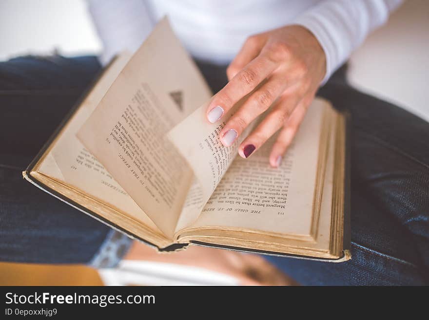 Girl thumbs through the old book