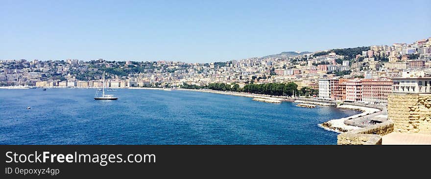 Black Ship on Blue Sea during Daytime