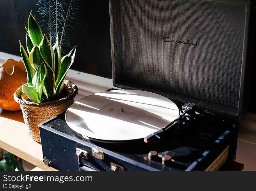 Vintage stereo turntable on shelf inside house. Vintage stereo turntable on shelf inside house.