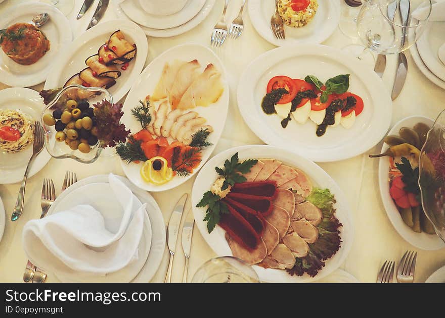 Assorted Dishes Served on White Ceramic Oval Plate on the Table