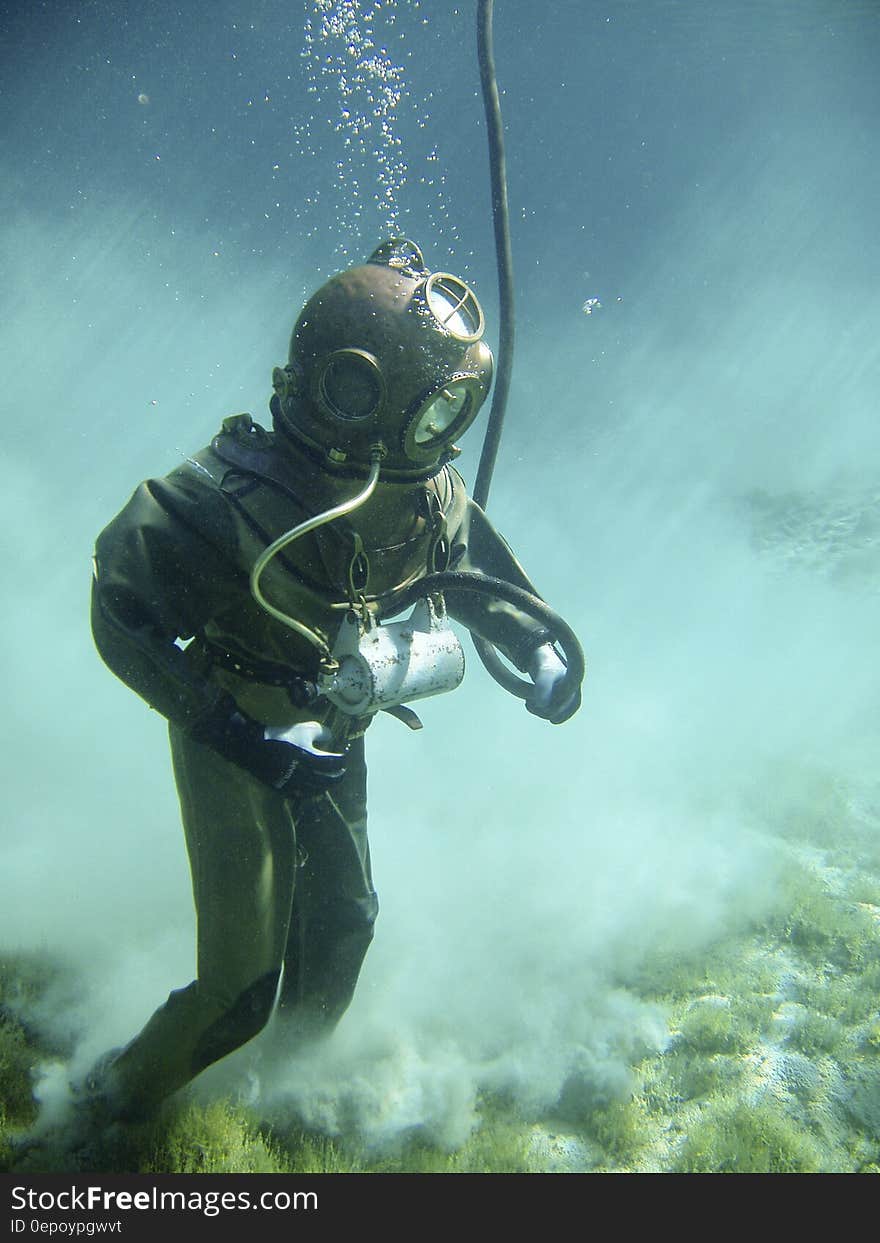 Person in Green Scuba Diving Suit