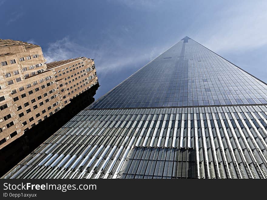 Facade of modern skyscraper against blue skies. Facade of modern skyscraper against blue skies.