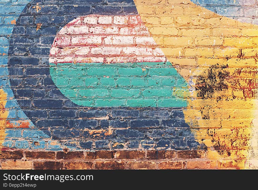 Yellow Green and Blue Brick Wall