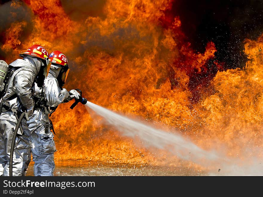 Photo of a 2 Fireman Killing a Huge Fire