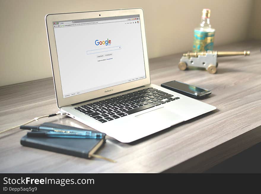 Macbook Air on Grey Wooden Table