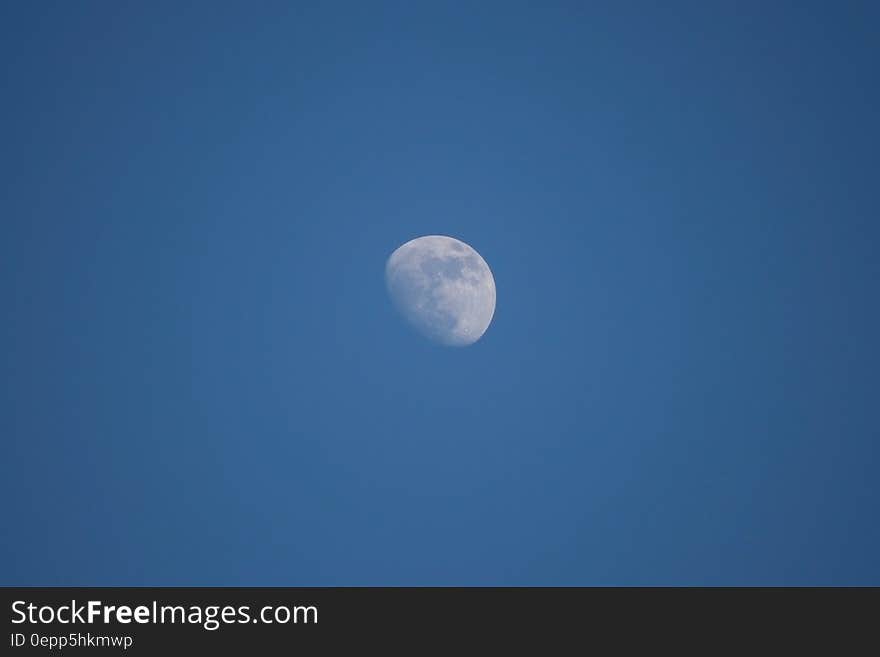 Full moon in blue skies at twilight. Full moon in blue skies at twilight.