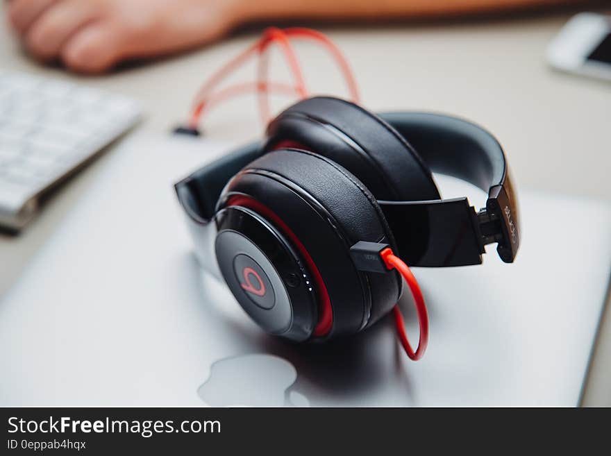 Close up of Beat headphones on Apple laptop.