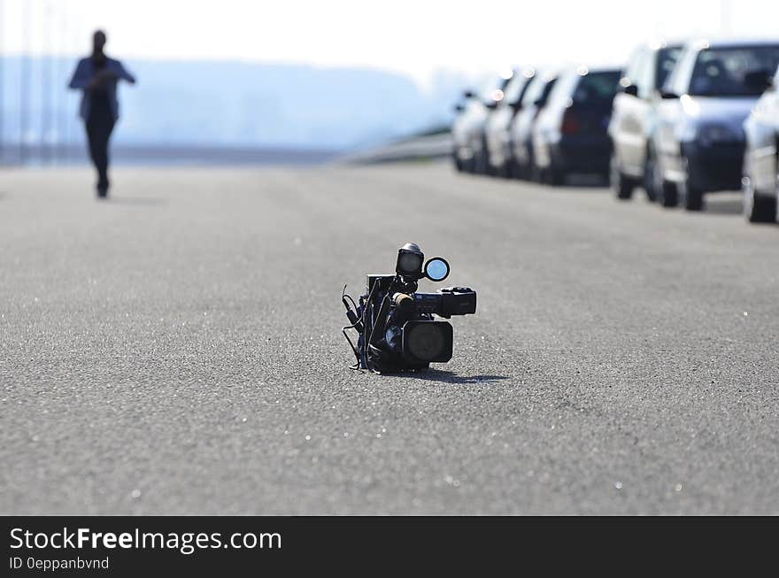 Video Camera on Asphalt Road