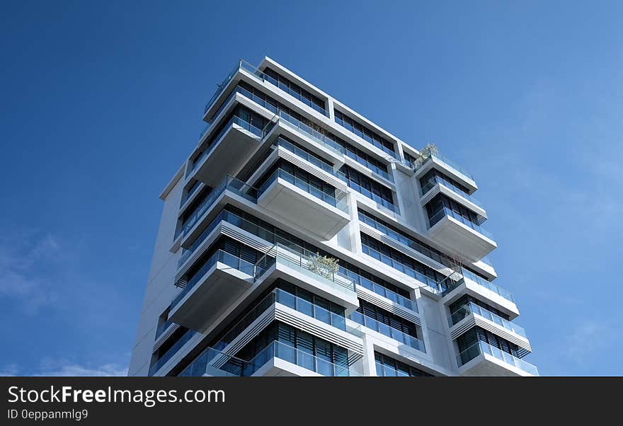 White Concrete Building Under Sunny Blue Sky