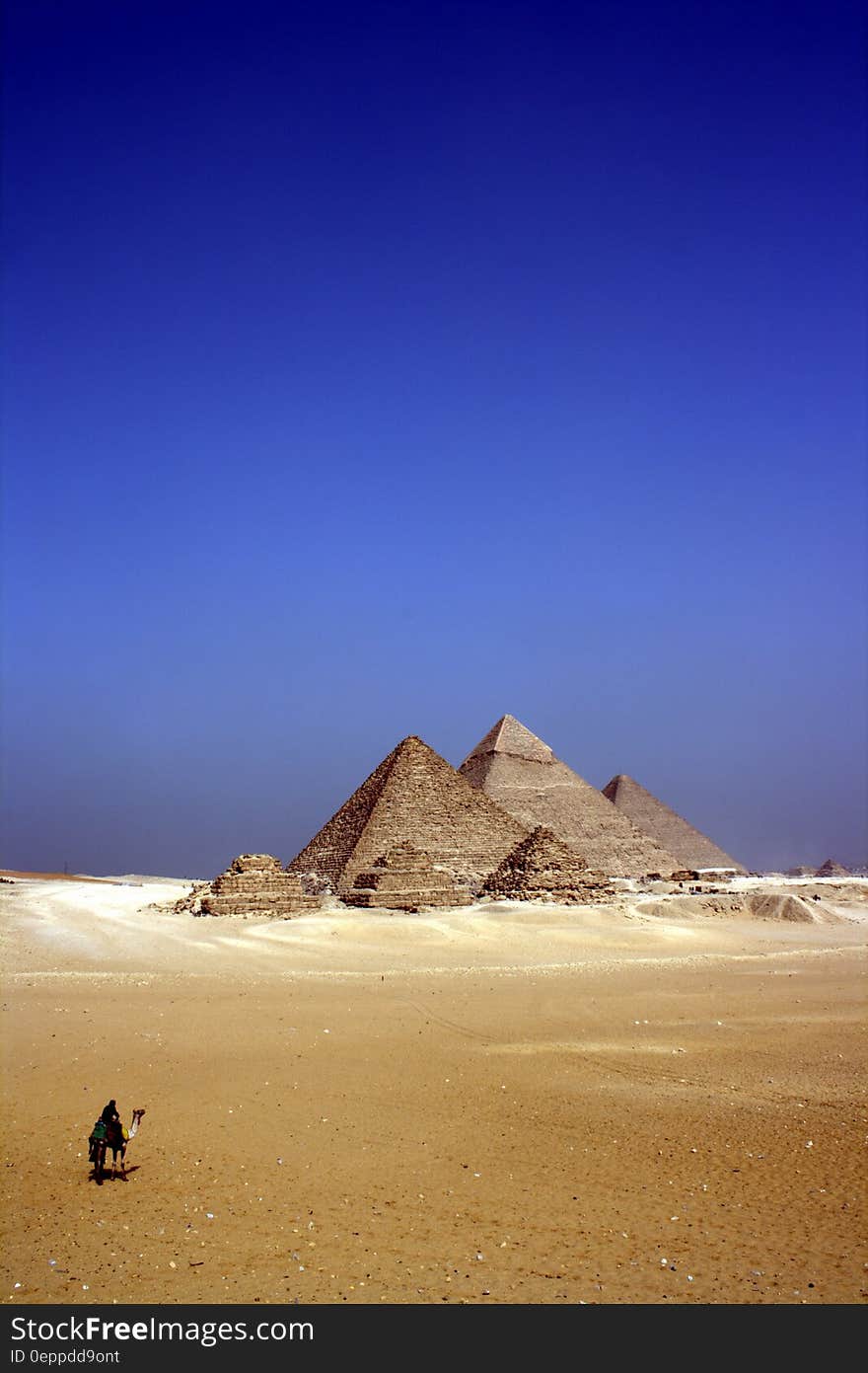 Grey Concrete Pyramids on the Middle of the Dessert during Daytime